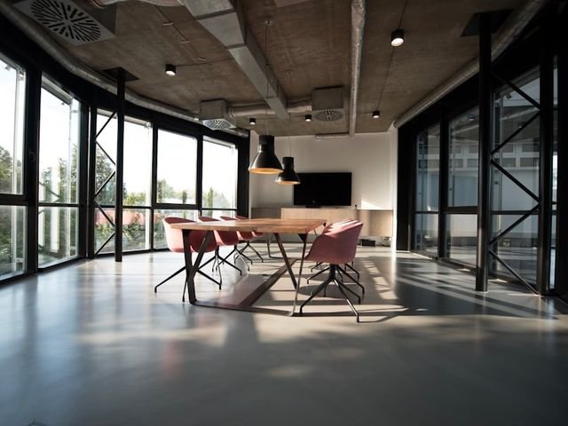 Meeting room table with upholstered chairs