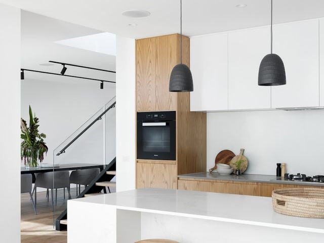 Kitchen island with wooden bar stools