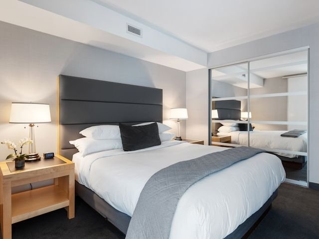 Bedroom with mirrored sliding wardrobe doors